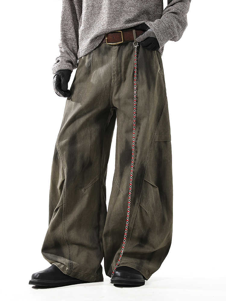 Washed and distressed curved-leg denim pants