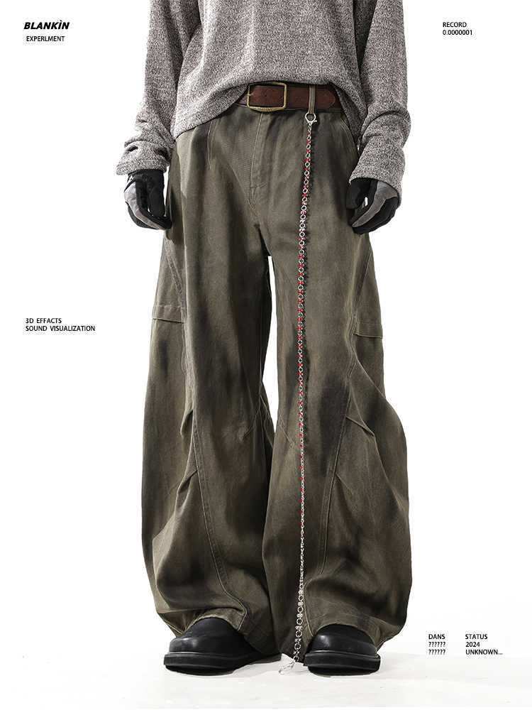 Washed and distressed curved-leg denim pants